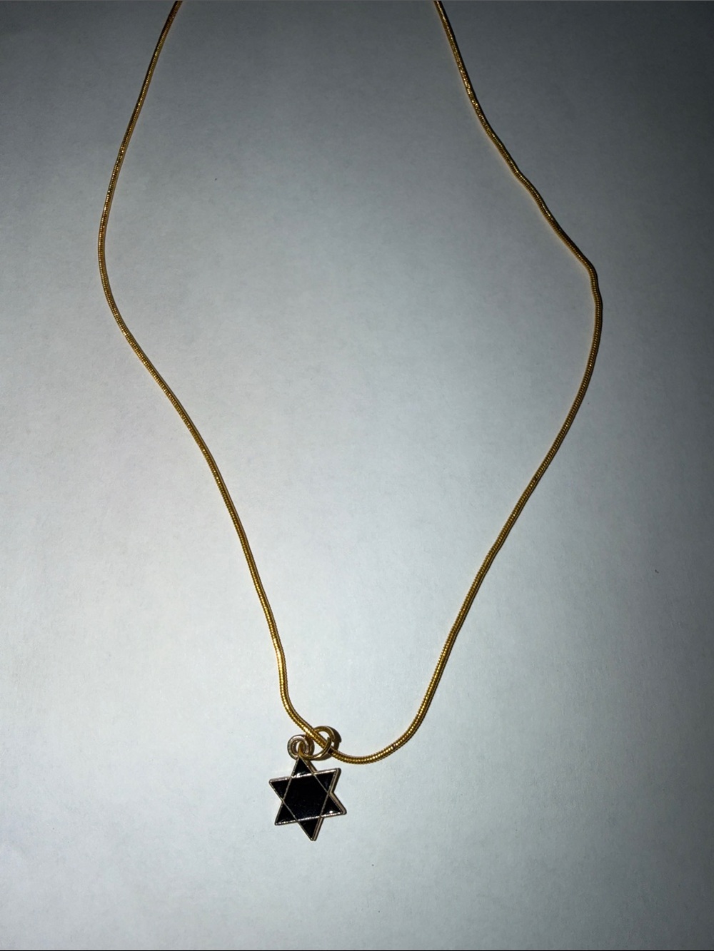 Gold-Tone Necklace with Black Star of David Pendant